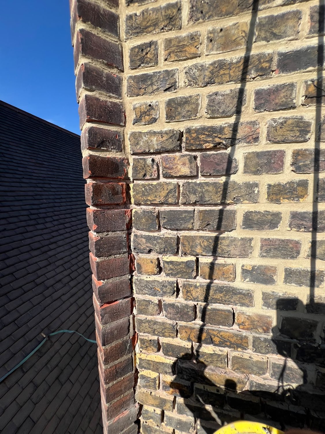 Chimney stack corner after repointing, joints crisp and consistent