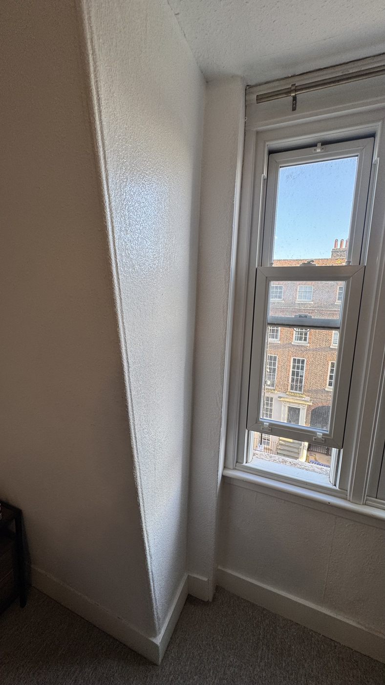 Completed window reveal replastered and redecorated after the water ingress repair